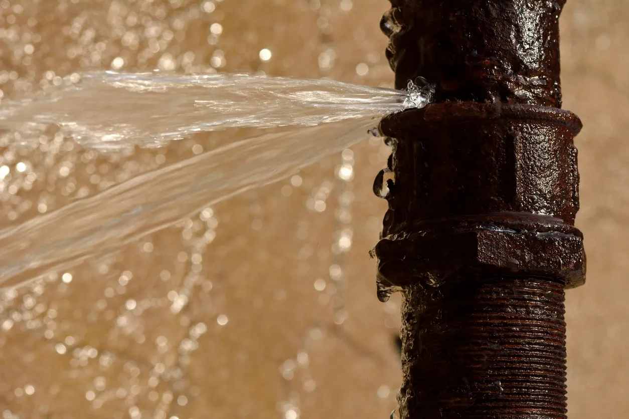 Water spraying out of rusty pipe. Mycotoxins, mold poisoning/illness and hyperbaric therapy (HBOT).