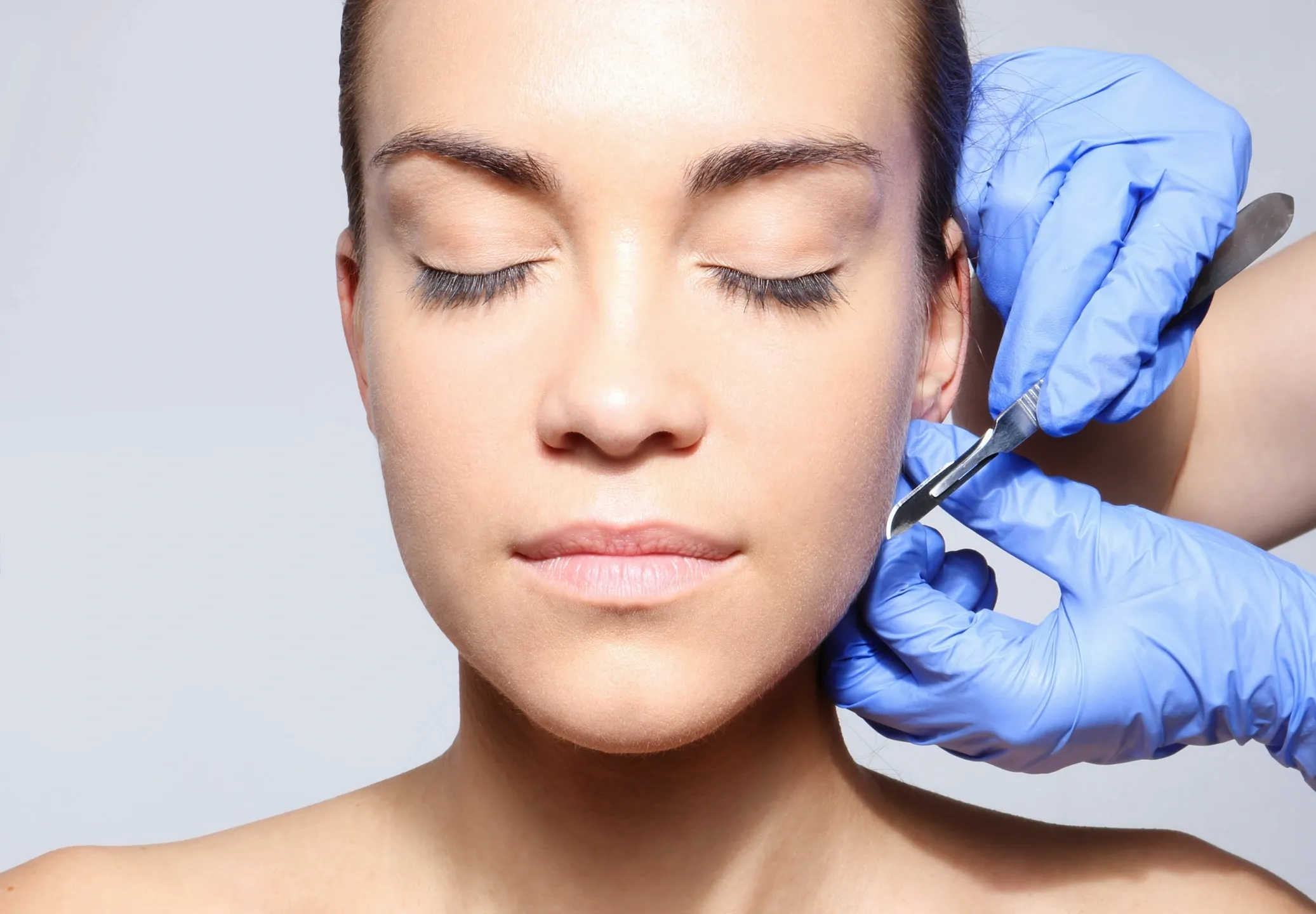 Woman undergoing facial plastic surgery.